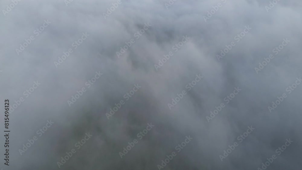 Aerial view of fog in the mountain at Gorontalo, Indonesia. Sunrise over the clouds in the morning Aerial view of fog in the mountain at Gorontalo, Indonesia. Sunrise over the clouds in the morning