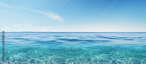 A serene image of the ocean with vast stretches of crystal clear water perfect for using as a copy space image
