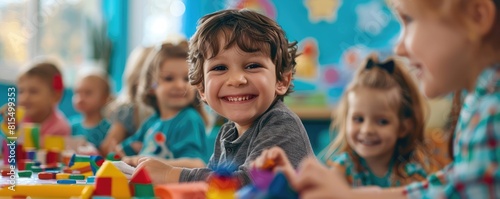 Happy child playing with colorful toy blocks among friends in a vibrant classroom.