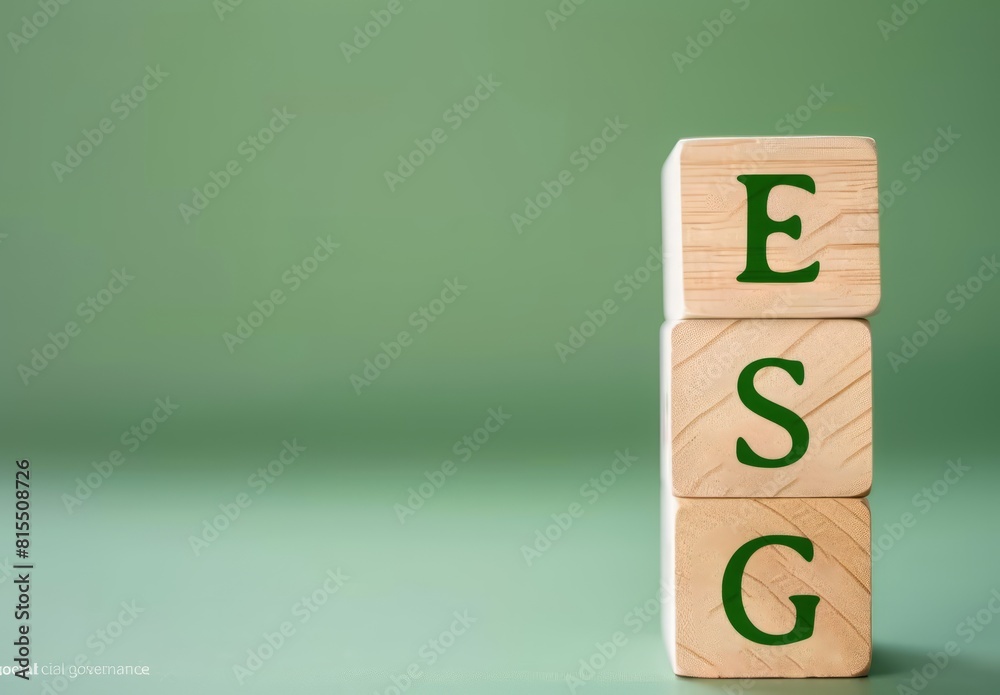 A stack of three wooden blocks with environment icons on green background A stack of three wooden blocks with environment icons on green background