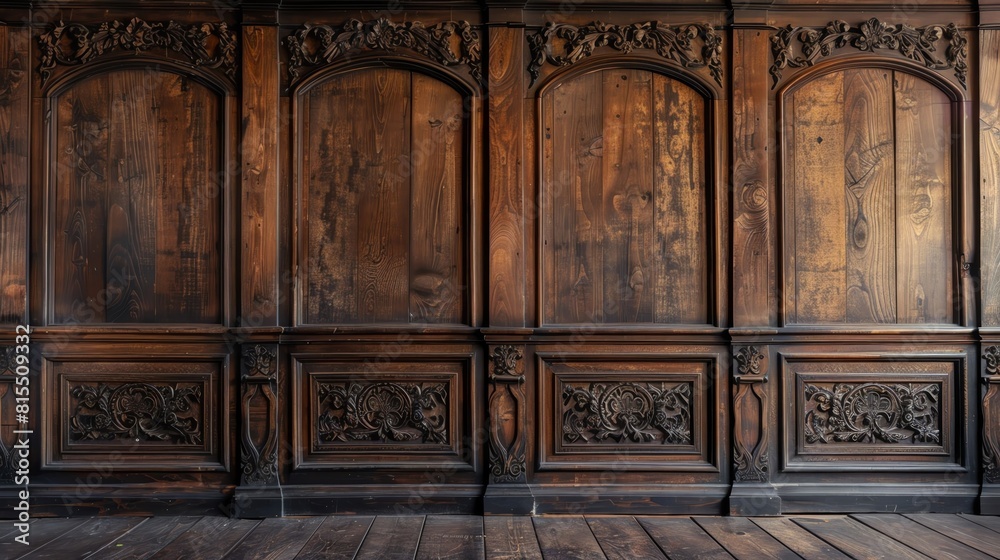 Obraz premium An antique wooden wall with carved panels and a deep, dark stain