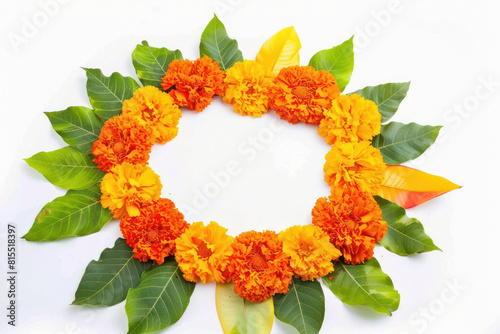 marigold flower and mango leaf rangoli on white background
