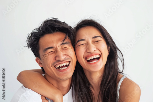 A playful hug between an Asian couple