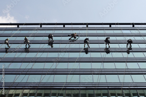 Professional window cleaning working in tower business center