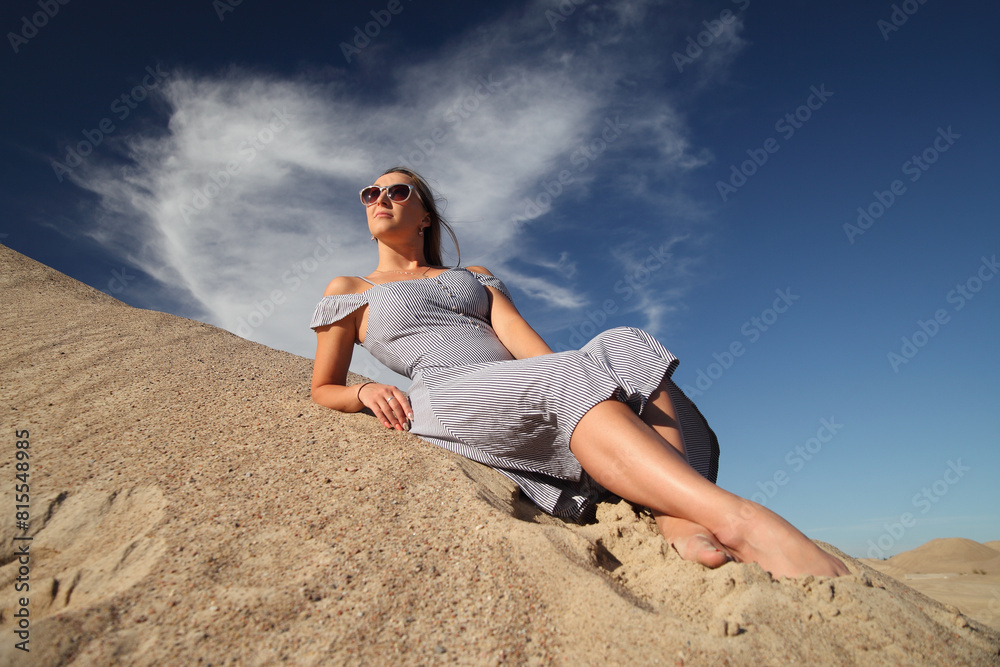 young woman on sandy mountain