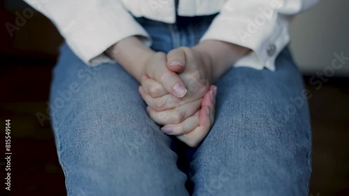 hands of a nervous woman. Hands close up. Cold wet palms. a disease of the cardiovascular system. Woman sitting on a chair