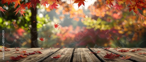 An outdoor setting with a wooden table surrounded by the vibrant colors of autumn and falling maple leaves  ideal for displaying products with lots of copy space 