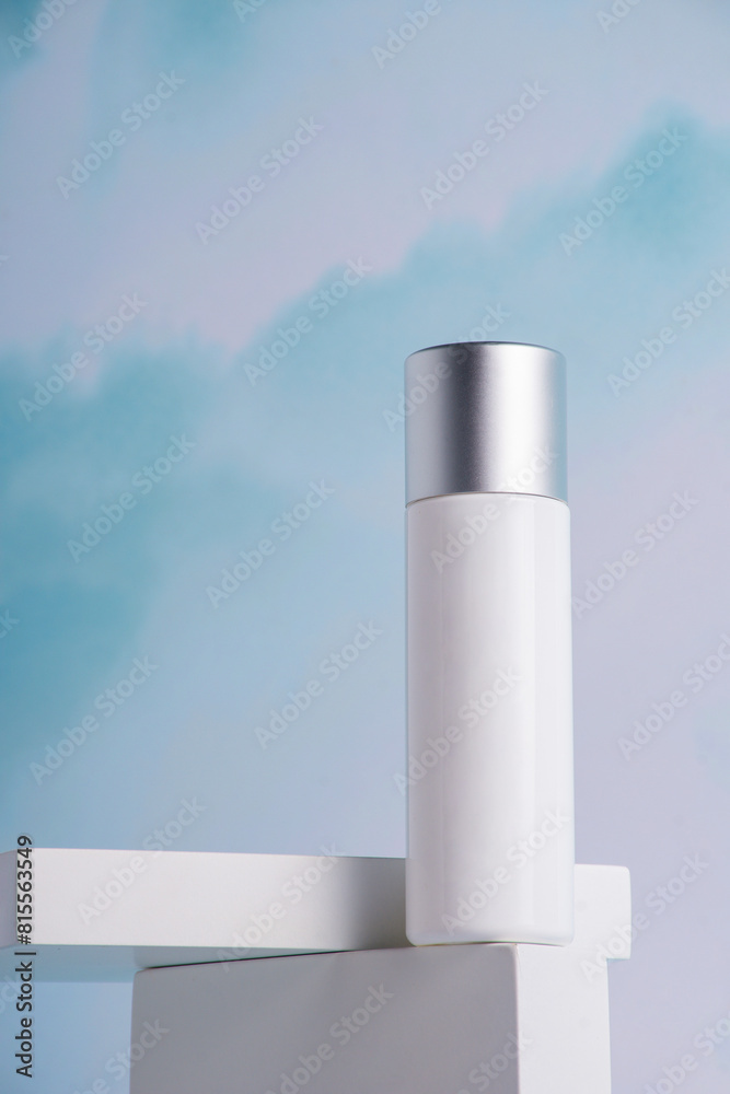 Cosmetic pink bottle, bottle, lotion or serum with stylish props on sky background.
Cosmetic pink bottle, bottle, lotion or serum with stylish props on sky background.