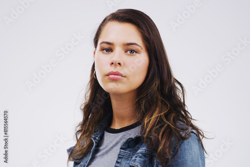 Girl, thinking and portrait in studio for mental health, anxious and stress or depression and anxiety. Young student or scholar and worry mindset or sad for exam, test or moody for studies © peopleimages.com