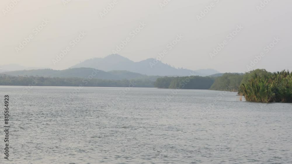 background of the video features a natural evening atmosphere along the river,with the blur of the evening sunlight hitting the water surface and the wind blowing across the mountains. background of the video features a natural evening atmosphere along the river,with the blur of the evening sunlight hitting the water surface and the wind blowing across the mountains.
