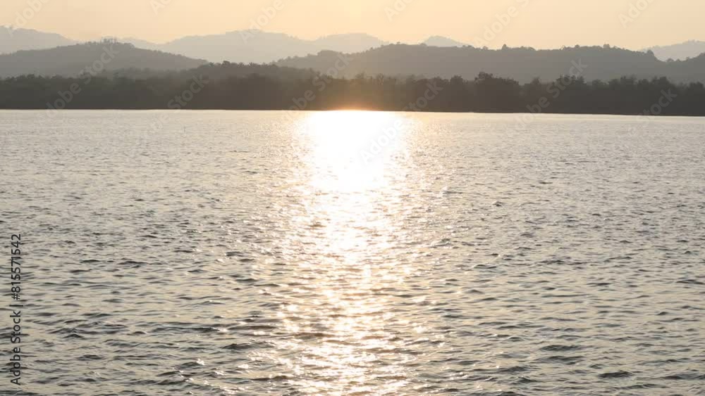 background of the video features a natural evening atmosphere along the river,with the blur of the evening sunlight hitting the water surface and the wind blowing across the mountains. background of the video features a natural evening atmosphere along the river,with the blur of the evening sunlight hitting the water surface and the wind blowing across the mountains.