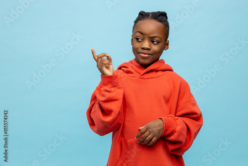 Cute african american boy in orange hoodie