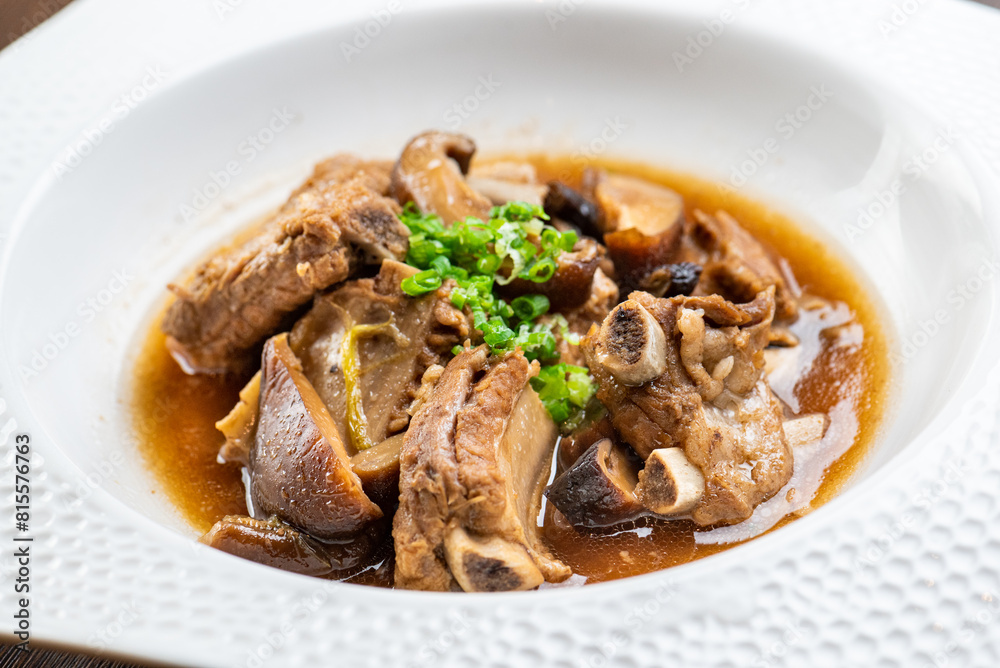 A bowl of delicious spare ribs in brown sauce A bowl of delicious spare ribs in brown sauce