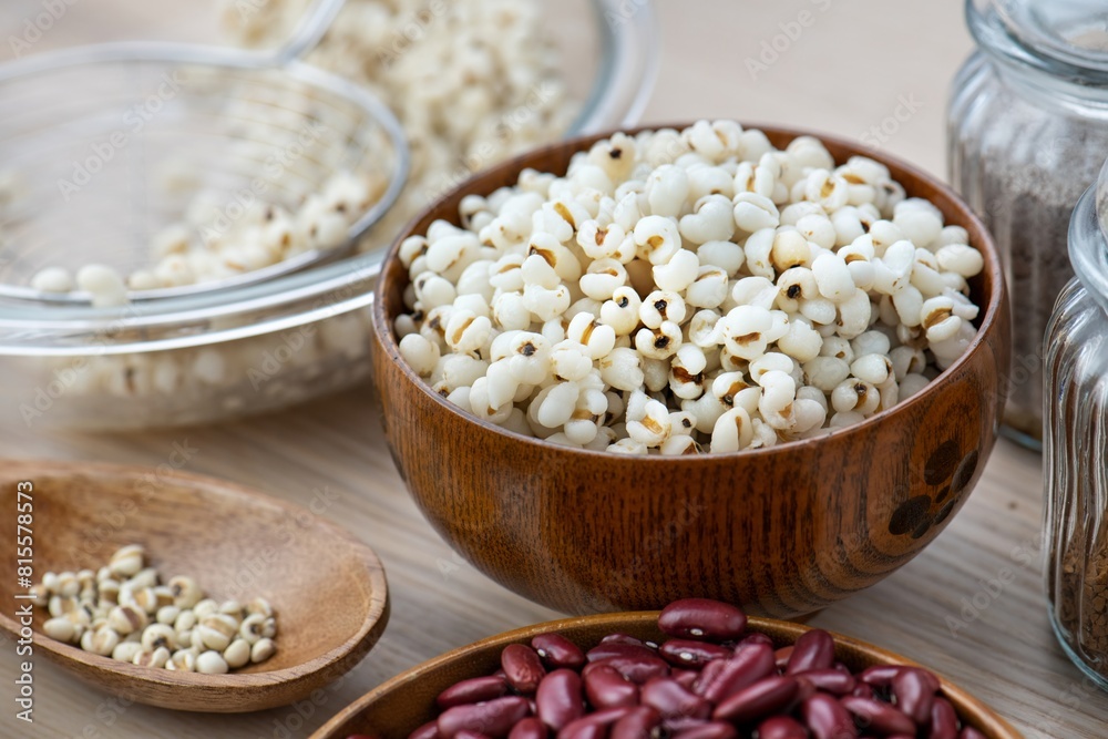 Hot Boiled Job’s Tears millet seed from boiler. White boiled Job’s Tears is highly nutritious cereal healthy fresh organic in salad dish.Hand chef drawing Boiled Job’s Tears to dish for cool down Hot Boiled Job’s Tears millet seed from boiler. White boiled Job’s Tears is highly nutritious cereal healthy fresh organic in salad dish.Hand chef drawing Boiled Job’s Tears to dish for cool down