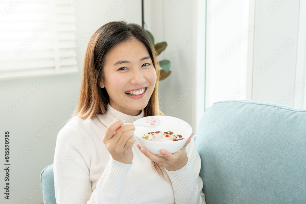 healthy food. Beautiful female girl enjoy eat yogurt, granola, fresh fruits on breakfast health in house. Happy young woman smile on morning good emotion. dieting, detox, diet, clean eat, vegetarian healthy food. Beautiful female girl enjoy eat yogurt, granola, fresh fruits on breakfast health in house. Happy young woman smile on morning good emotion. dieting, detox, diet, clean eat, vegetarian