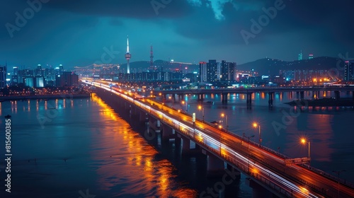 The night view of the city from the bridge is very beautiful. The lights of the city are reflected on the river  like a