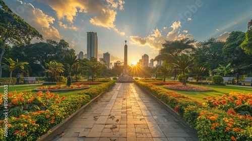 The park is beautiful with many flowers and trees. The sunlight shines through the trees. The park is a nice place to relax and enjoy the outdoors. photo