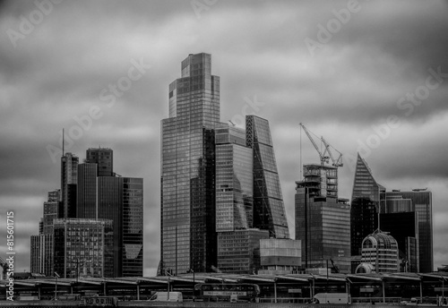 Grayscale of a city skyline on a cloudy day