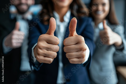 Close up business thumbs up sign on blurred background of business people s hands gesturing like photo