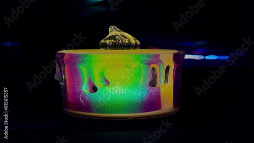 Neon led candle light glowing colourfully in a dark background photo