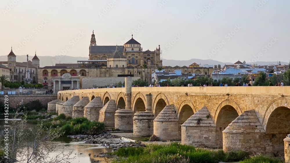 Roman bridge spanning over a tranquil river in Cordoba, Andalusia, Spain Roman bridge spanning over a tranquil river in Cordoba, Andalusia, Spain