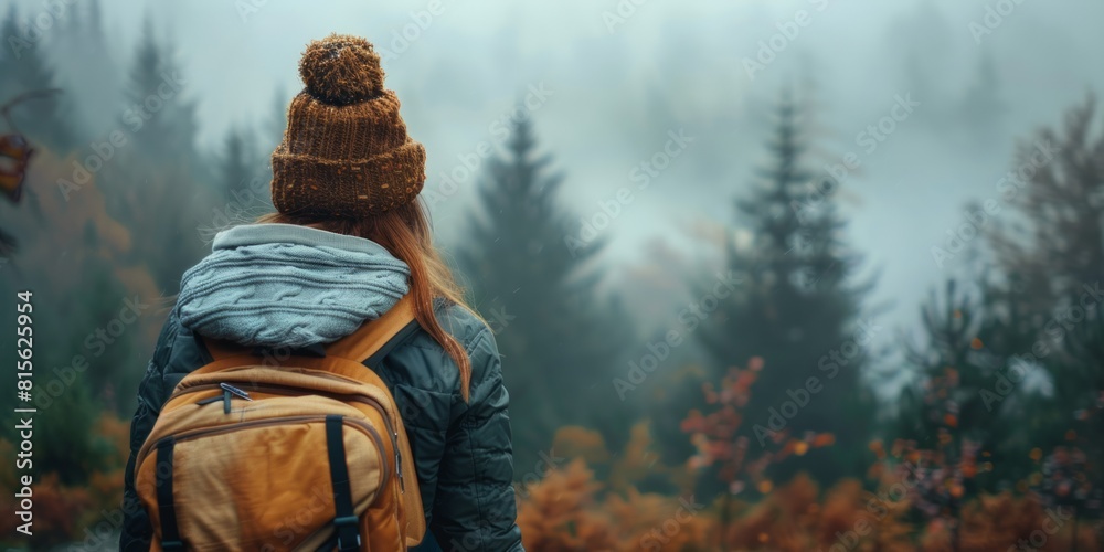 Woman with knit hat and backpack hiking in foggy woodland illustration Woman with knit hat and backpack hiking in foggy woodland illustration