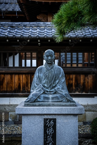 Statue of an ancient Japanese Buddhist monk and hero at Sengakuji Buddhist Temple in Tokyo Japan. photo