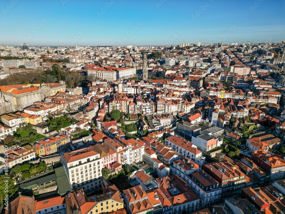 metropolitan cityscape featuring Clerigos Tower and vibrant red-tiled roofs in Portugal, Porto metropolitan cityscape featuring Clerigos Tower and vibrant red-tiled roofs in Portugal, Porto