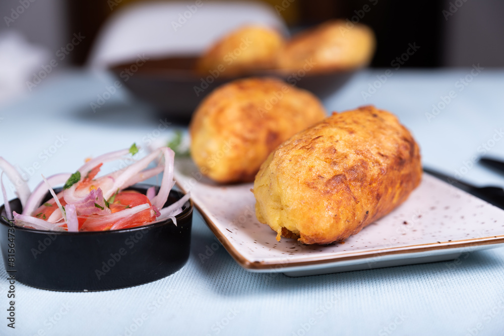 Crispy potato topping that exposes a delicious Peruvian filling. Crispy potato topping that exposes a delicious Peruvian filling.