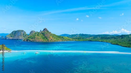 Aerail view of  tropical exotic island sand bar separating sea in two with turquoise  in El Nido  Palawan  Philippines.