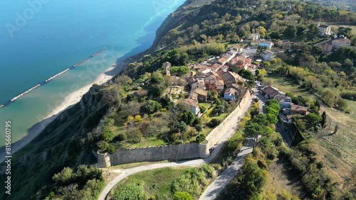 Aerial footage of the village of Fiorenzuola di Focara on the Mediterranean coast in Pesaro, Italy