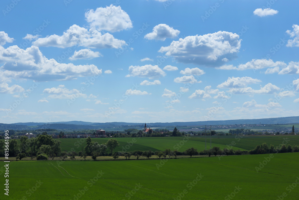Beautiful landscape with green field and blue sky with white clouds. Beautiful landscape with green field and blue sky with white clouds.