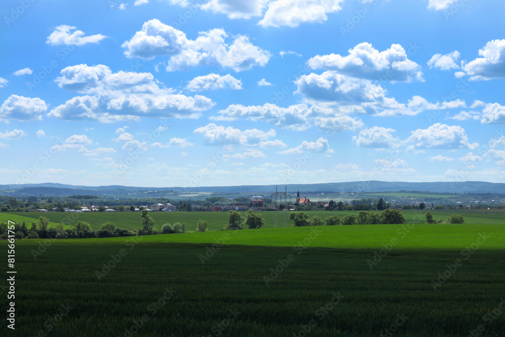 Beautiful landscape with green field and blue sky with white clouds. Beautiful landscape with green field and blue sky with white clouds.