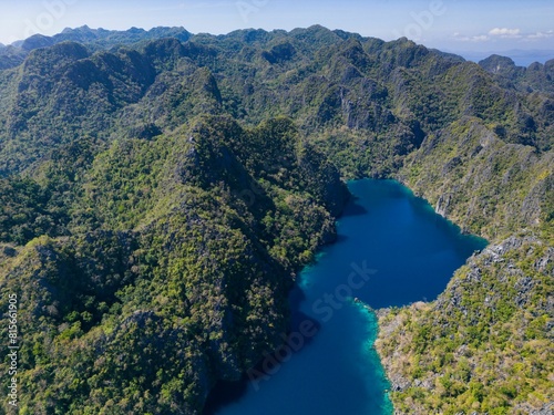 Scenic landscape of Kayangan Lake in Coron, Philippines illuminated by a brilliant blue sky