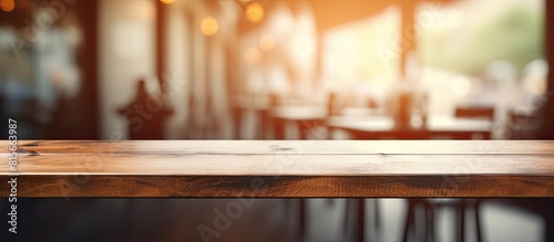 Empty wooden table space platform and blurred resturant or coffee shop background for product display montage. copy space available