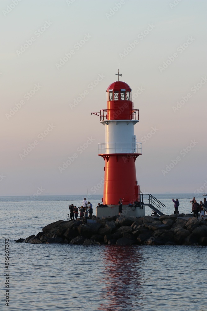 Lighthouse on the coast of the Baltic Sea in Germany, at sunset Lighthouse on the coast of the Baltic Sea in Germany, at sunset