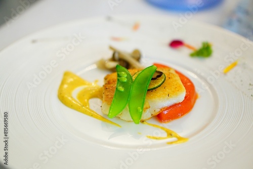 Delicious plate of cod fish dish served on a white plate