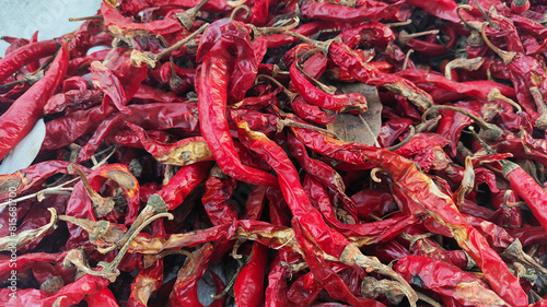 Dried large red chilies on a white base