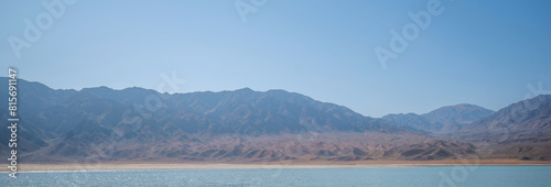 The lake is surrounded mountains. Wild nature of China.