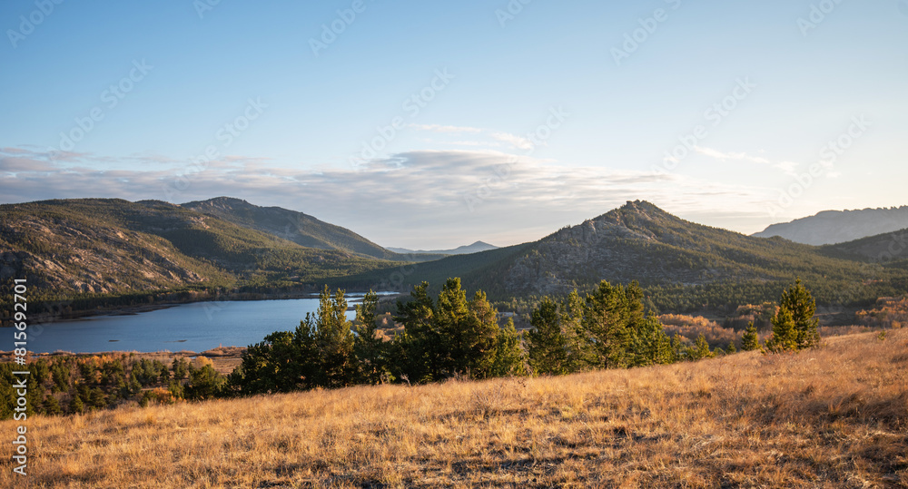 View of beautiful countryside at sunset. Beautiful autumn landscape in the hilly. Grassy field and hills. Rural landscapes. View of beautiful countryside at sunset. Beautiful autumn landscape in the hilly. Grassy field and hills. Rural landscapes.
