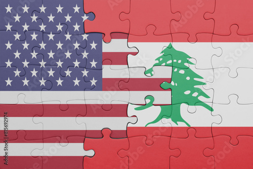 puzzle with the colourful national flag of lebanon and flag of united states of america . photo