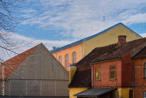 View of the tiled roofs of houses in the historical center of the city. Sunny weather.