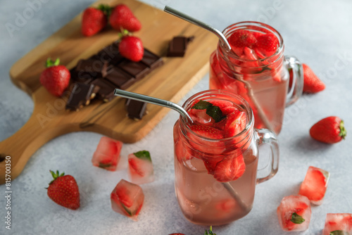 Strawberry diet drink with berries and wooden board with dark chocolate. Fruit drink and healthy concept © artifirsov