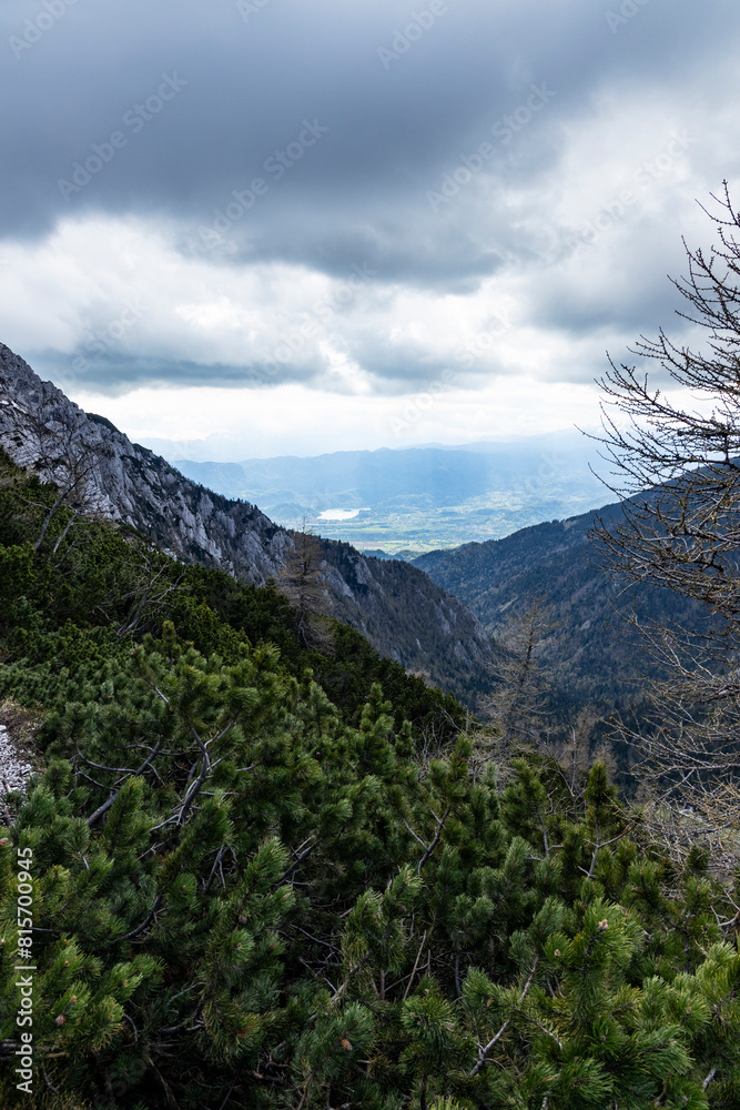 Begunjščica panorama of mountain trekking to the highest peak. View of the Alps, climbing with via ferrata. Distant view of Lake Bled from above. Sports holidays, life of adventure in the countryside Begunjščica panorama of mountain trekking to the highest peak. View of the Alps, climbing with via ferrata. Distant view of Lake Bled from above. Sports holidays, life of adventure in the countryside