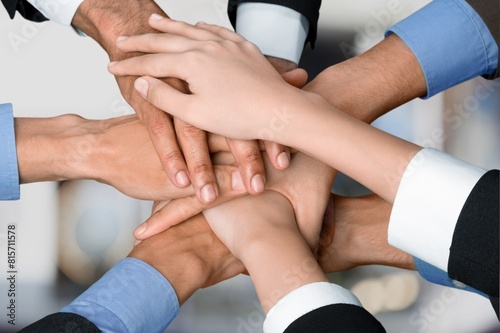 High five  team of businesspeople hands together