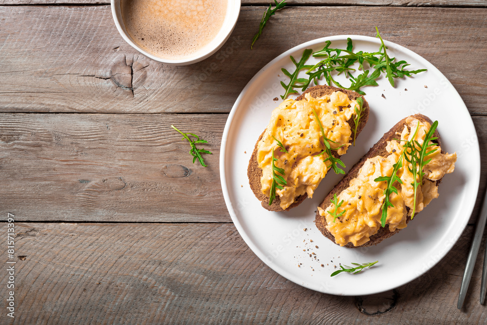 Scrambled eggs sandwiches with arugula microgreens Scrambled eggs sandwiches with arugula microgreens
