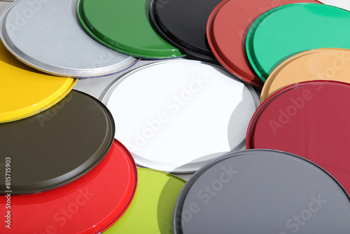 lids of colorful paint cans