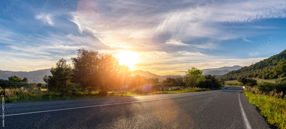 Mediterranean sea coast road into mountains horizon in summer with beautiful bright sun rays