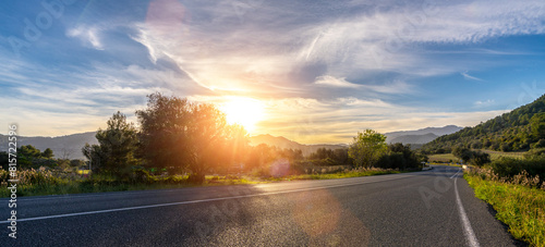 Obraz na płótnie Mediterranean sea coast road into mountains horizon in summer with beautiful bright sun rays w salonie