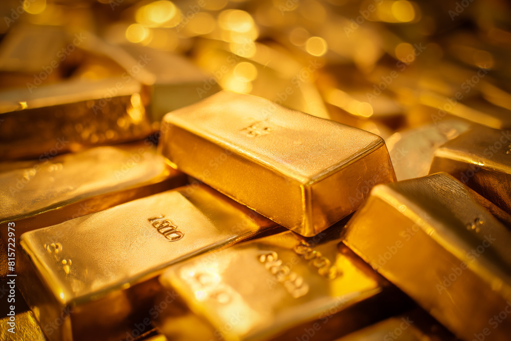 A pile of gold bars bullions close up A pile of gold bars bullions close up